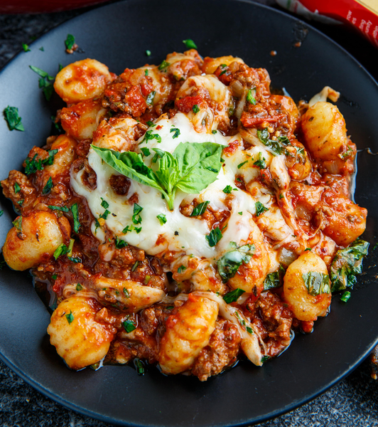 Ñoquis al horno con mozzarella a la boloñesa