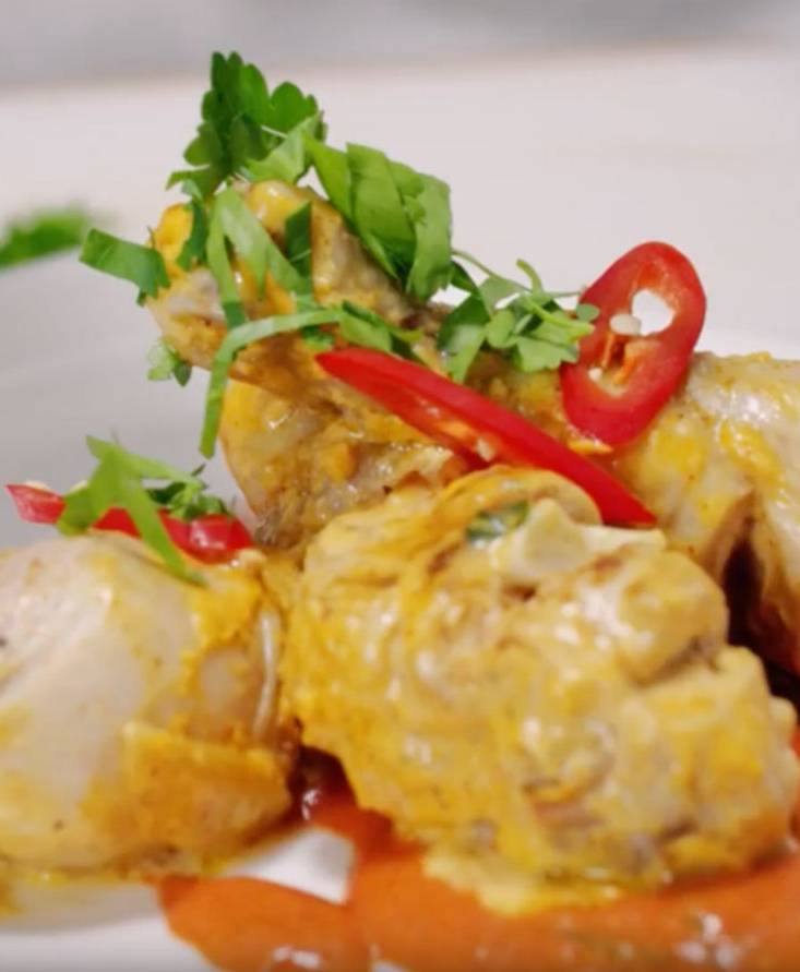 Coconut marinated chicken in tomato broth