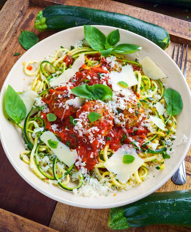 Zucchini turkey meatballs in a marinara sauce on spaghetti