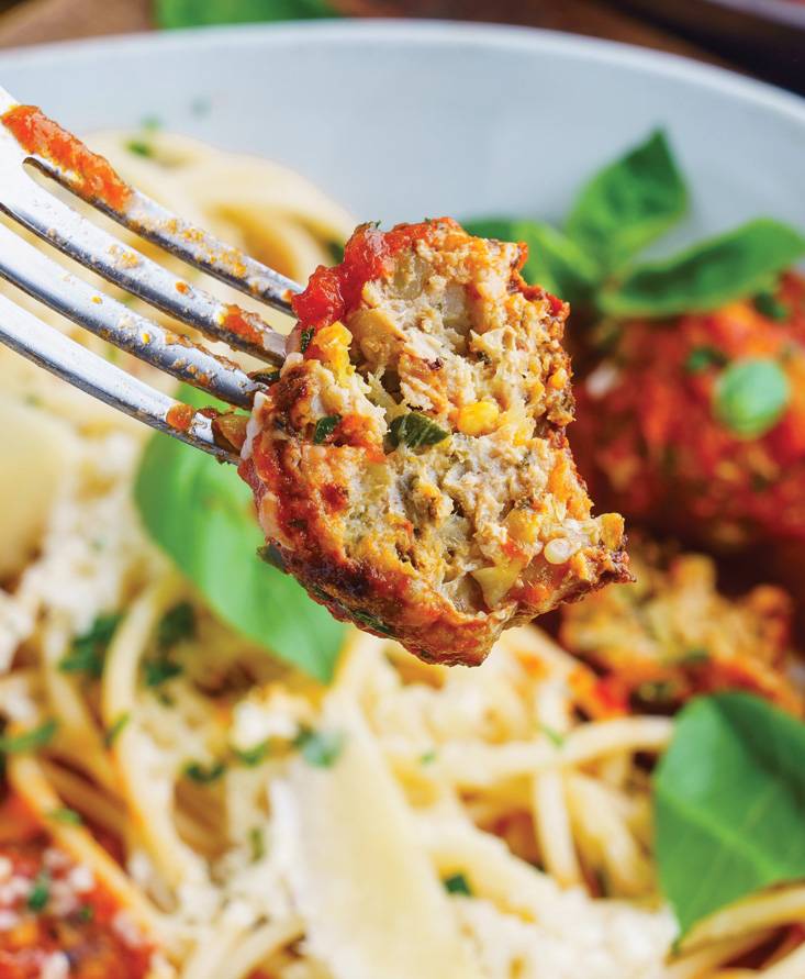 Zucchini turkey meatballs in a marinara sauce on spaghetti